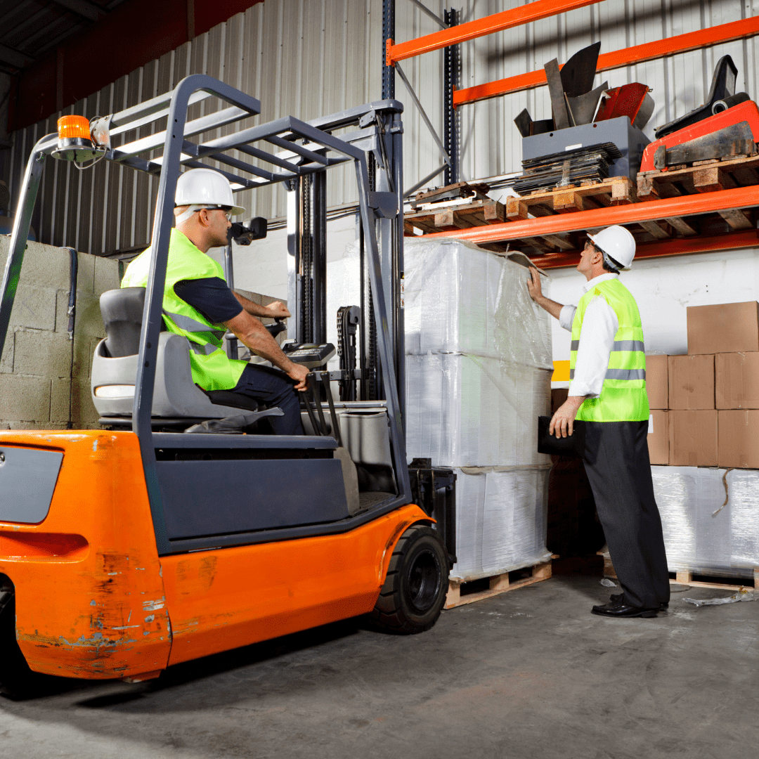 A picture of a warehouse worker using a forklift to move a pallet of boxes